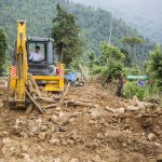 Gary Young on the backhoe clearing debris in Nepal